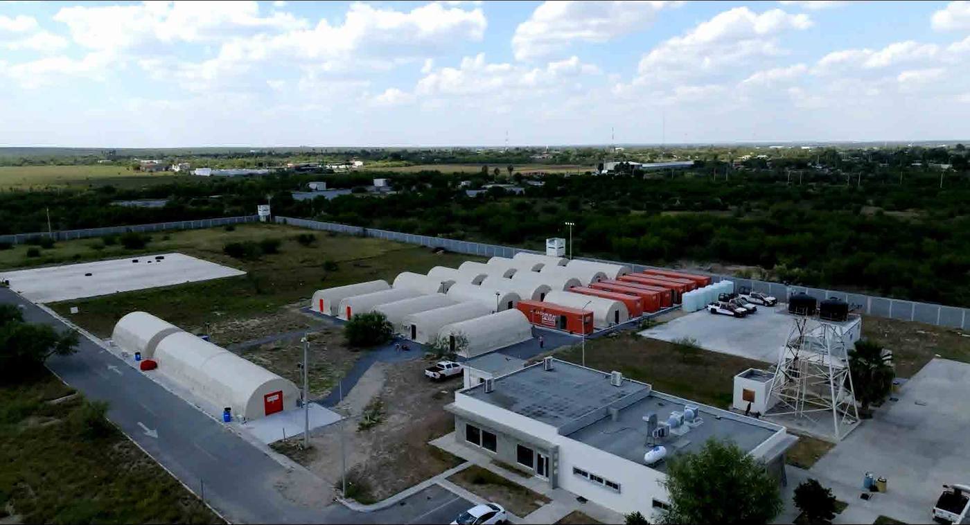 Aerial view of complete camp facility with tents and support buildings