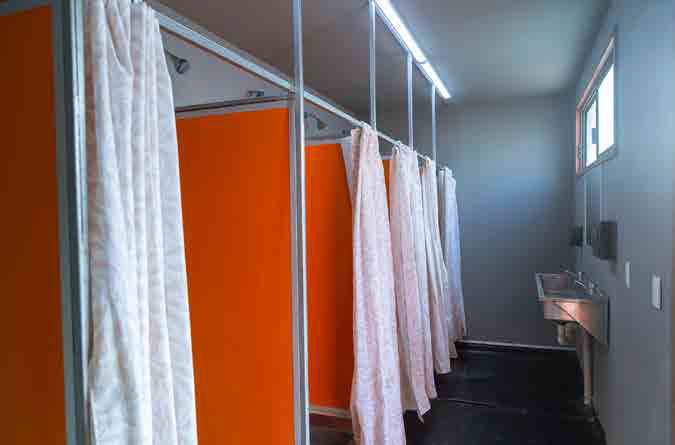 Shower stalls inside modular sanitation unit