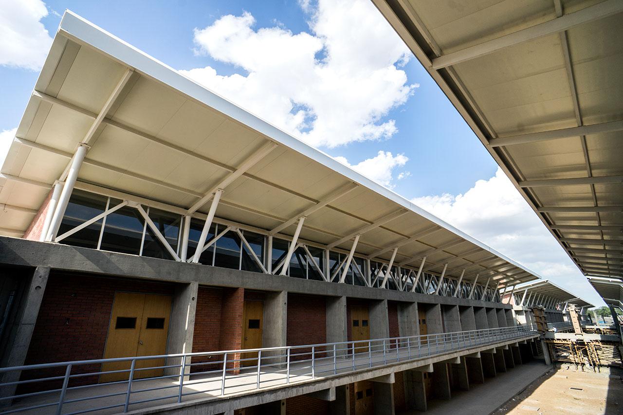 Completed institutional building with steel roof structure